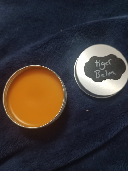 Tiger Balm: Jojoba Oil, Beeswax, and Herbal Blend